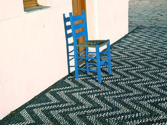 Blue chair in front of the Agios Ioannis church